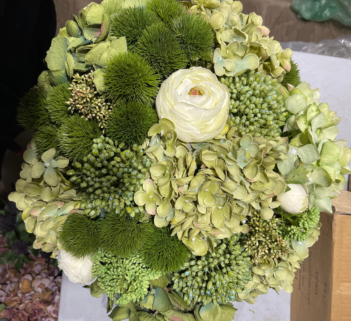 Green Hydrangeas in black bowl