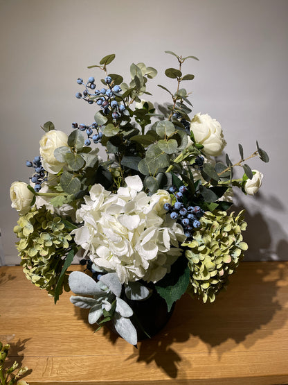 Hydrangeas & blueberries arrangement in ceramic vase